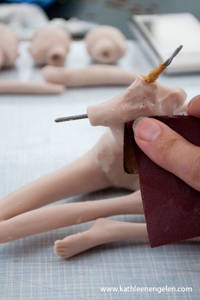 sanding the fairy sculpture